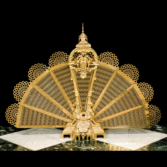 An Antique Gilt Brass Peacock Fire Screen.