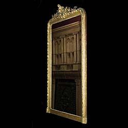 A French gilt and gesso antique overmantel mirror   