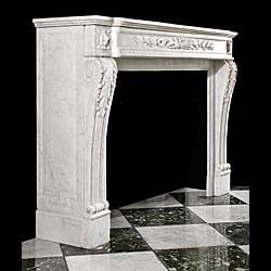 An antique Louis XVI style fireplace mantel