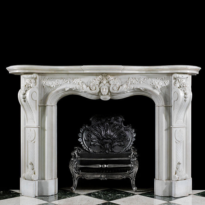 An antique Statuary Marble Rococo style fireplace surround