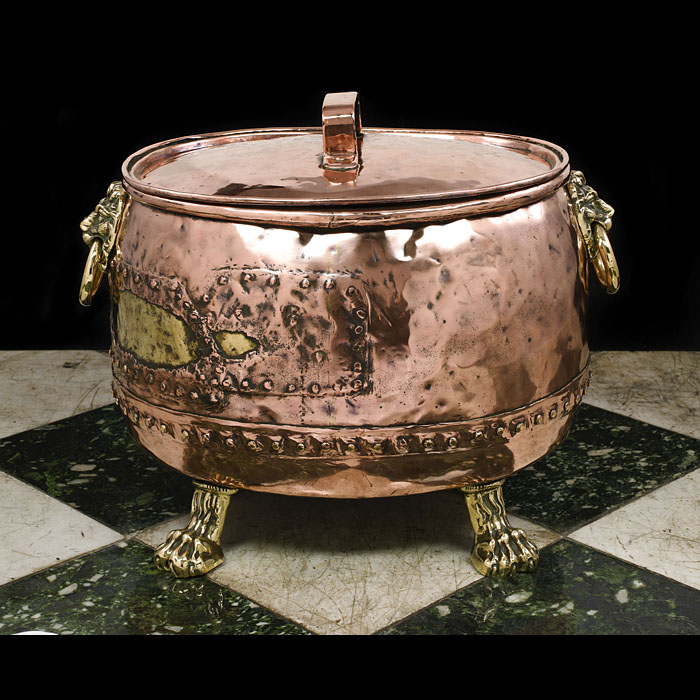 An antique Georgian copper log bin and cover 