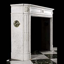 A Louis XVI Style Carrara Marble Fireplace