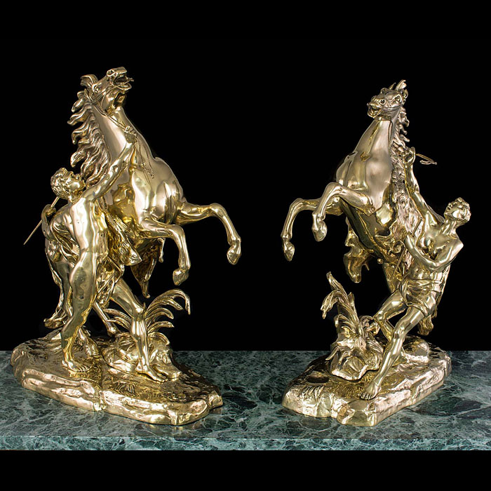 A pair of model Marley Horses cast in brass