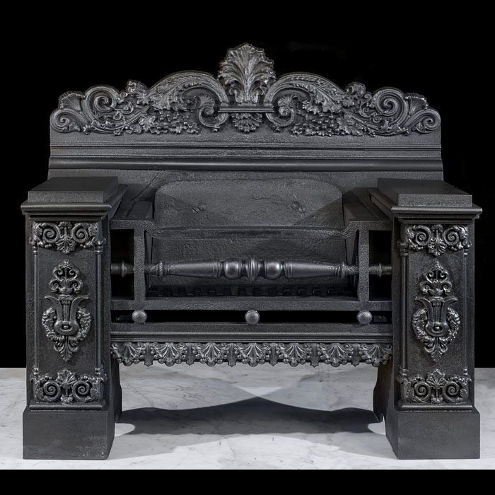 An ornate antique cast iron hob grate 