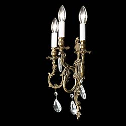 A 20th century set of four gilt brass wall lights    