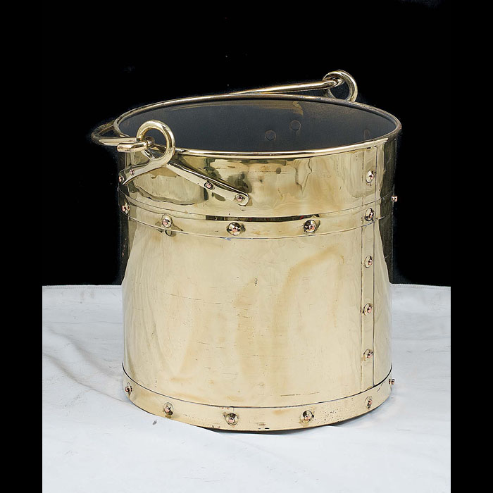 A 1930's studded brass coal or log bin    