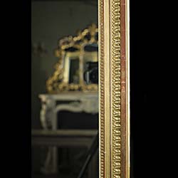 A Tall French Gilded Overmantel Mirror.