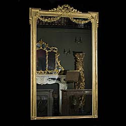 A Tall French Gilded Overmantel Mirror.