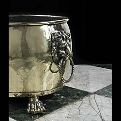 An Edwardian brass lion mask log bin    