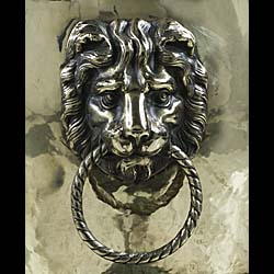An Edwardian brass lion mask log bin    