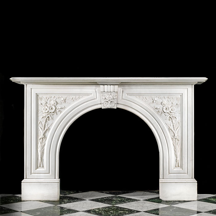 A white marble antique arched Victorian fireplace 