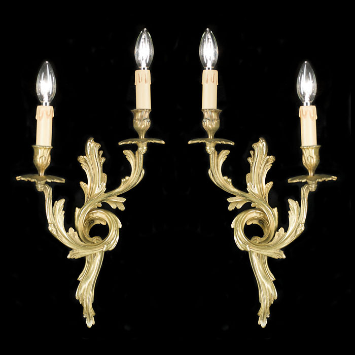  A 20th century pair of Rococo style wall lights   