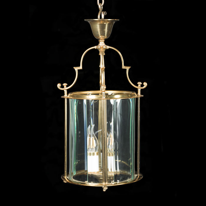 A Brass and bevelled glass hall lantern