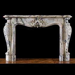 A Louis XV style Pavonazzo chimneypiece