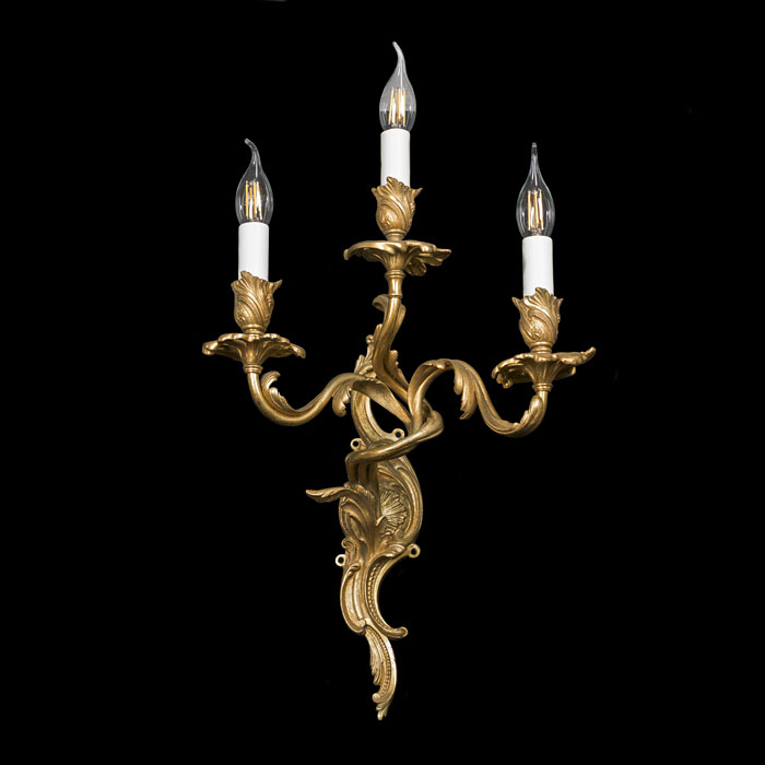 A pair of Rococo style brass wall lights