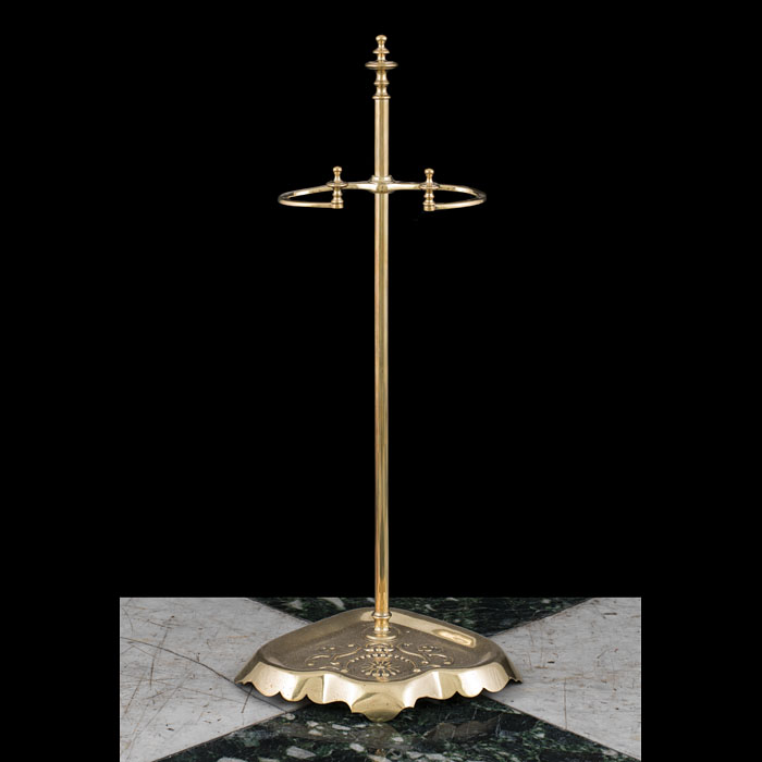  An early Victorian brass fire tool stand
