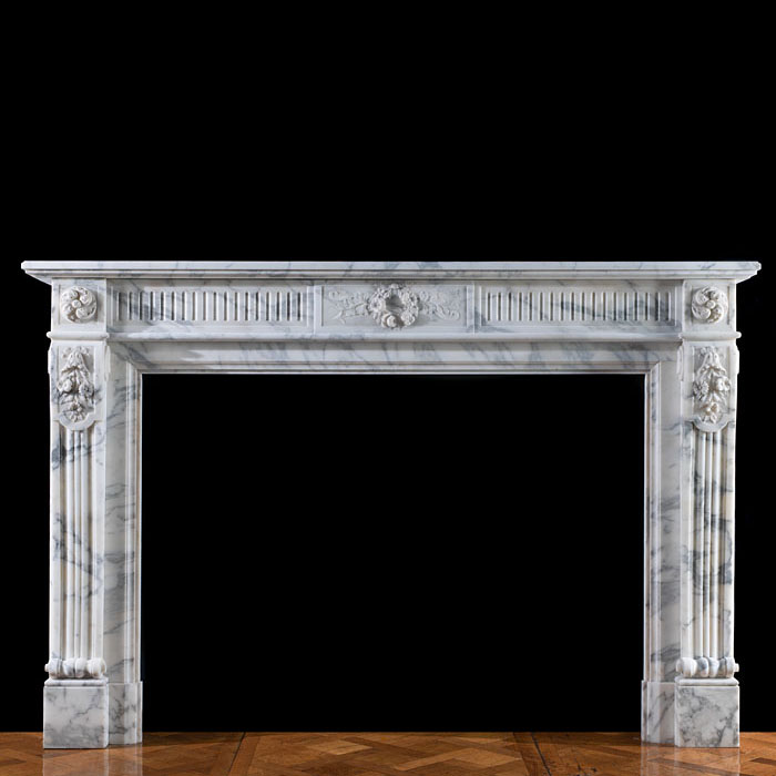 A Louis XVI style Arabascato fireplace
