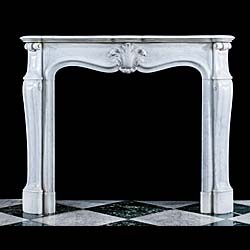 A small marble French Rococo fireplace