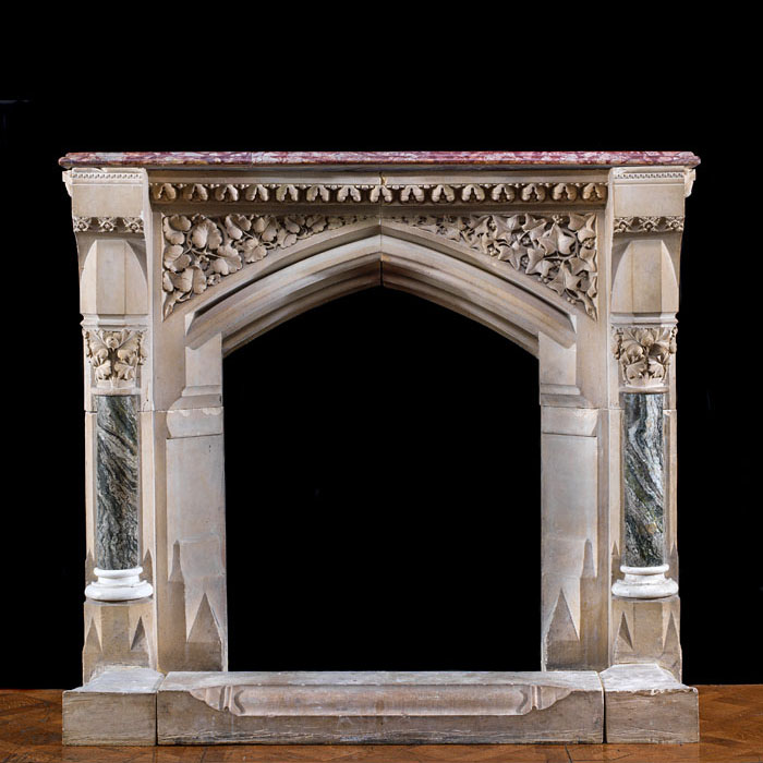 A stone Pugin Gothic Revival fireplace