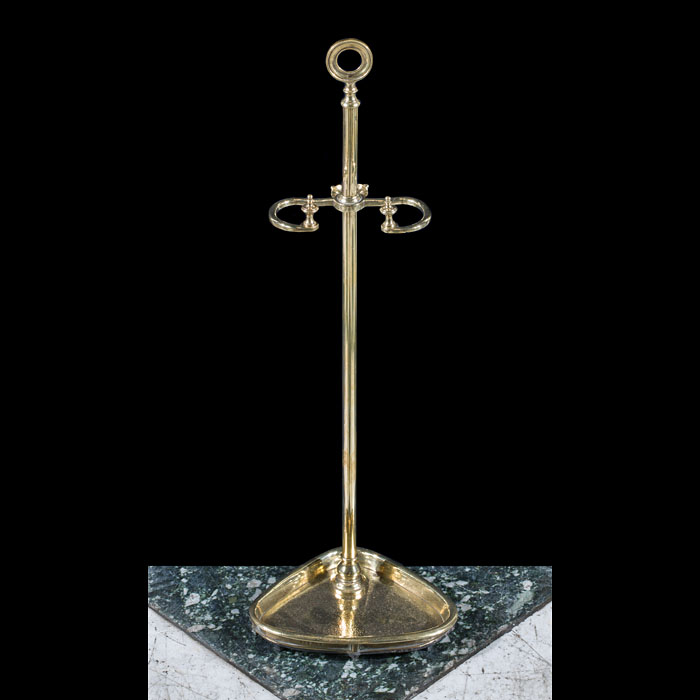 A simple Regency style brass tool stand