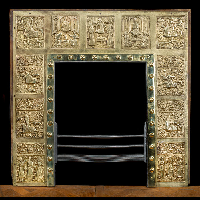  An Edwardian brass fireplace insert