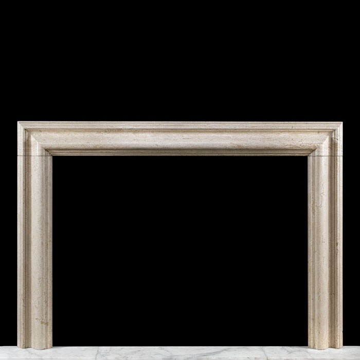 A creamy Travetine Bolection fire surround