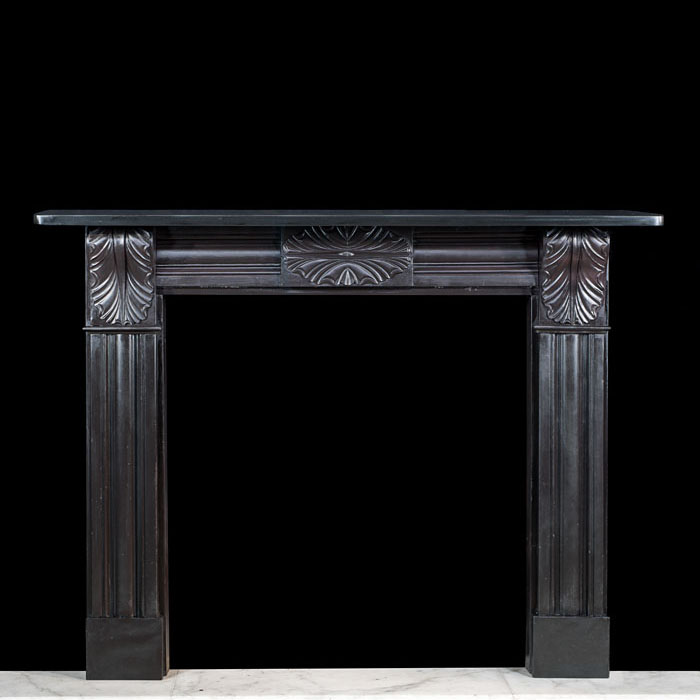 A black slate Regency corbel chimneypiece