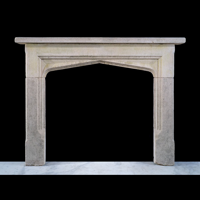 An Antique Tudor Revival Stone Fireplace 