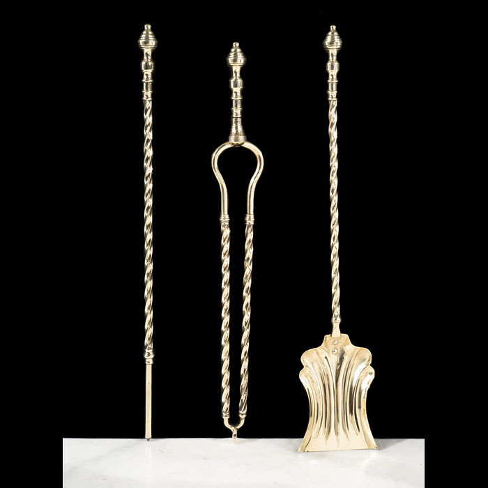 A Set of Three Polished Brass Fire Tools 