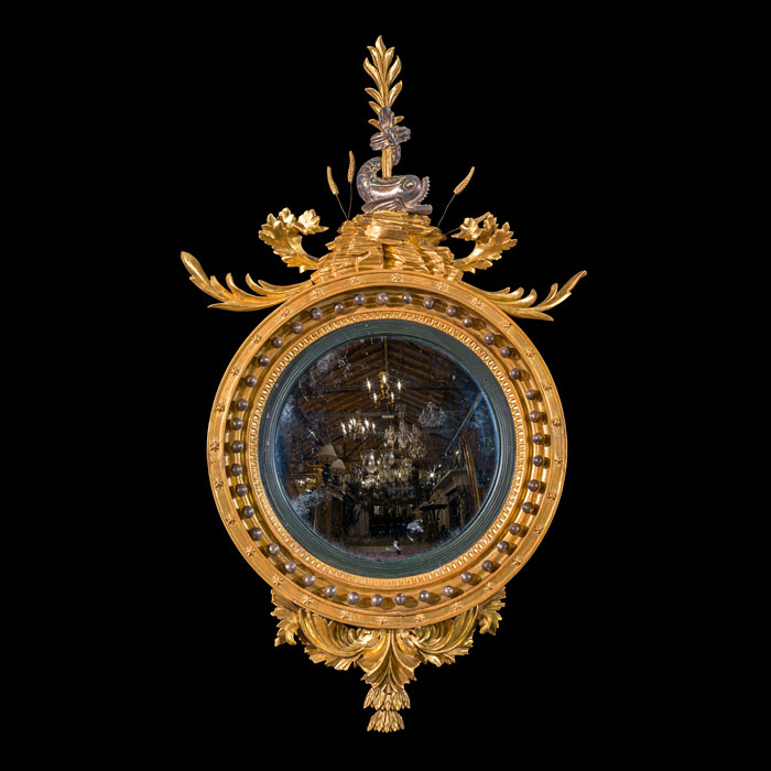 A Fine Regency Convex Mirror in Silver and Gold Leaf 