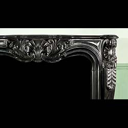 A Louis XV chimneypieces in namur black marble 