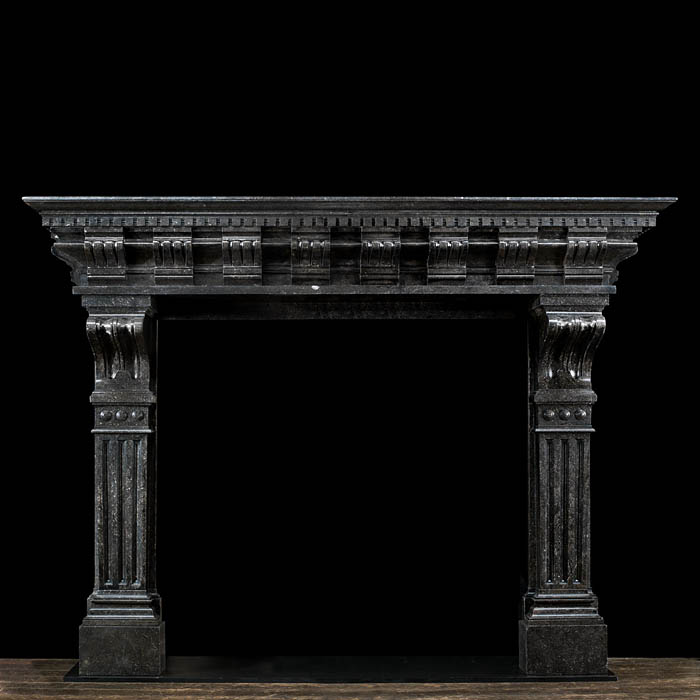 A large and impressive Belgian blue fossil stone fireplace in the Baroque style.