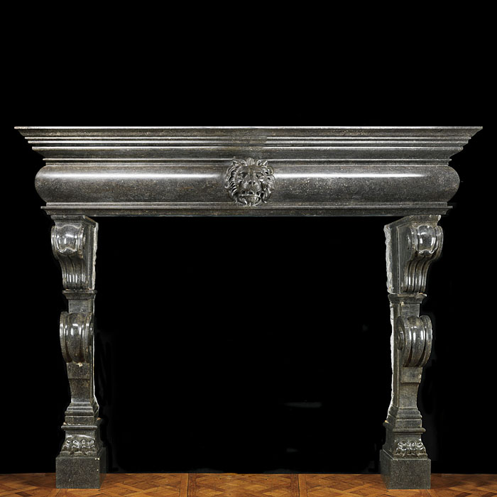 Antique Flemish dark fossil stone baroque Mannerist fireplace mantle
This grand Flemish Baroque chimneypiece has double contra scrolling tapering jambs which culminate in lion paws. These support a barrelled integral shelf and frieze which is centered by a magnificent lion's mask. 16th century and later.