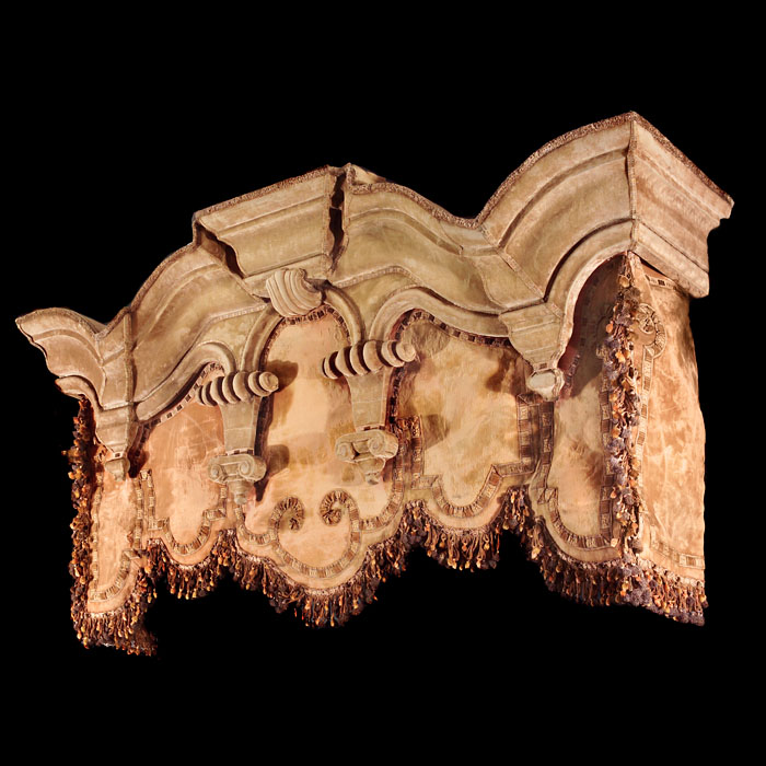 A large velvet draped Baroque style canopy