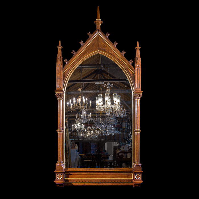 A Large Victorian Oak and Parcel Gilt Neo-Gothic Wall Mirror