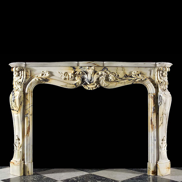  An antique French Rococo marble fireplace surround   