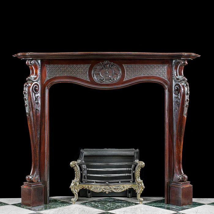 A Mahogany Rococo Style Fireplace Surround