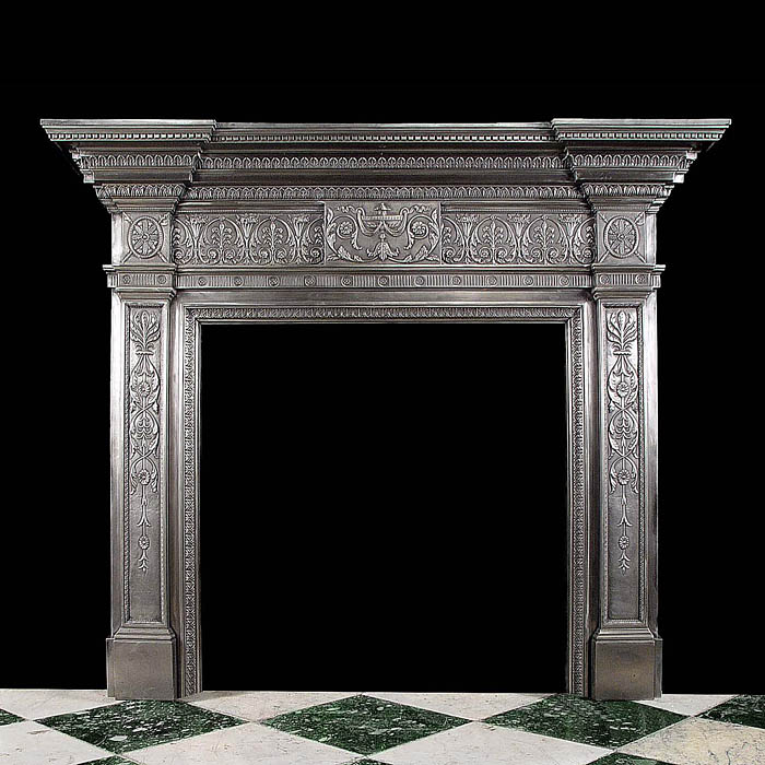 A Georgian style burnished cast iron Antique fireplace mantel