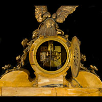 An antique Sienna and ormolu mantle clock